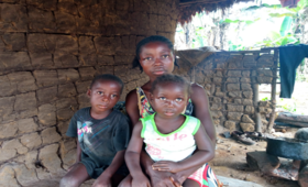 A teenage mother along with her two children in Liberia