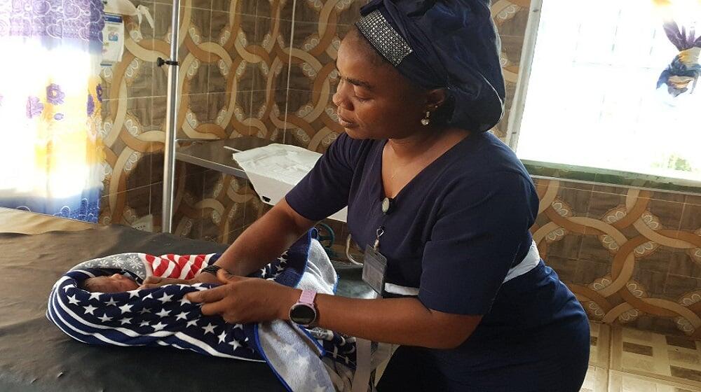 A Midwife prepares on a newborn the Bahn Health Center, Nimba County, Liberia