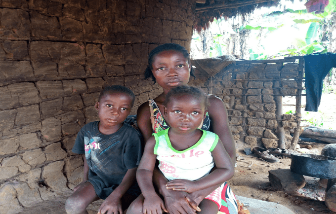 A teenage mother along with her two children in Liberia